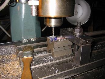  17-Nov-02  Milling a keyway slot in the spur shaft.  With the table cranked all the way over to the 